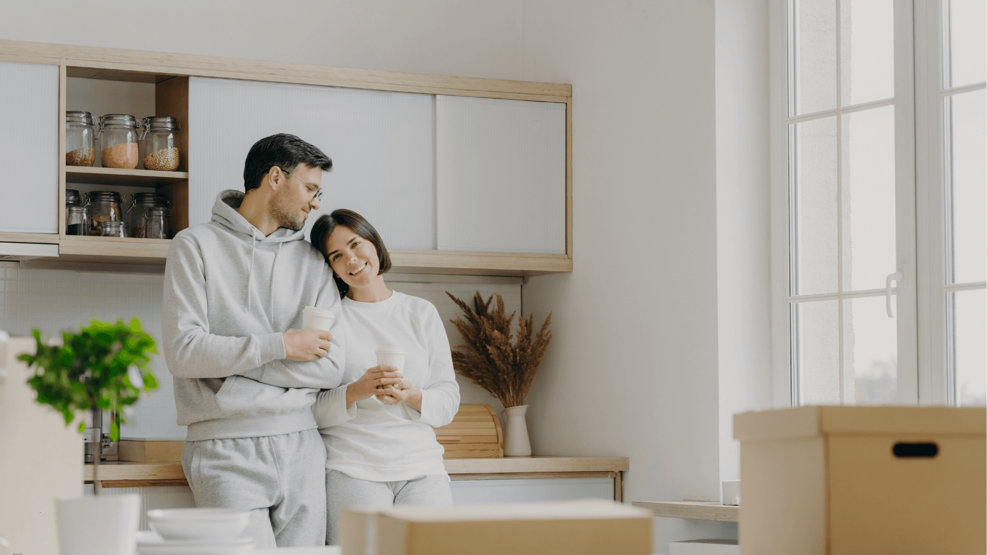 couple looking happy in a home kitchen