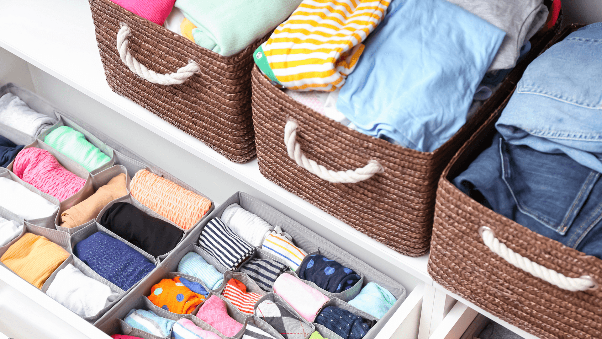 Organized closet with clothes in drawer organizers